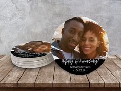 two personalized coasters with an image of a man and woman on the front