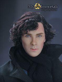 a close up of a doll wearing a black coat