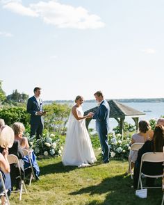 a bride and groom standing at the end of their wedding ceremony