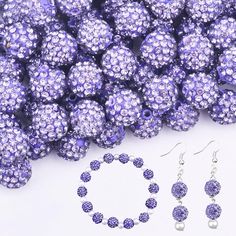 purple beads and earrings on white background