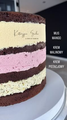 there is a cake with different layers on the top and bottom layer, along with words above it