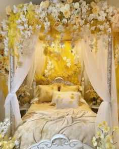 a bed with white and yellow flowers on the headboard, curtains, and pillows