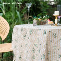 the table is set for two outside in the garden