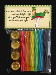 st patrick's day party favors with gold coins and paper straws in cello bags