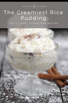 the cremest rice pudding is served in a glass bowl with cinnamon sticks on the side