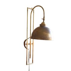 an old style lamp with a metal shade