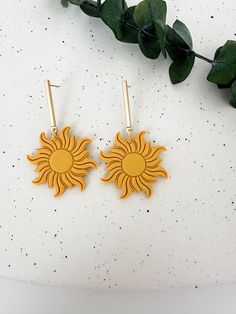 These dangly sun earrings are the perfect touch to brighten your day! Earrings measure approximately 2.25 inches in length and 1.25 inches in width and are lightweight. Hand sculpted polymer clay earrings, crafted delicately and finished with attention to detail. Hypoallergenic nickel-free posts, hoops, hooks, and silicone backs are used on all pieces.  Due to their handmade nature, colors and textures will vary slightly with each piece. Earrings are lightweight and durable, though they will bre Sun Polymer Clay Earrings, Clay Sun, Earrings Western, Nature Colors, Sun Earrings, Boho Sun, Western Earrings, Grad Pics, Painted Leaves