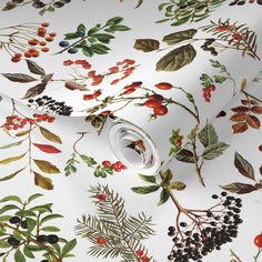 a white wallpaper with red berries and green leaves on the side, along with black berries