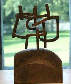 a sculpture sitting in front of a window