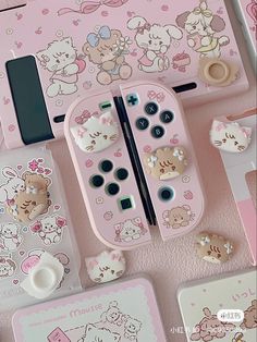 an assortment of hello kitty themed items are displayed on a pink surface with white writing