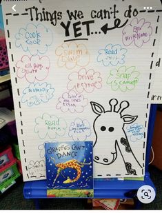 a bulletin board with writing on it and a giraffe in the middle next to it