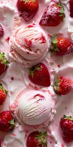 some strawberries and ice cream are on top of each other in a dish with white icing