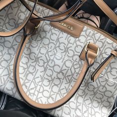 Brand New Calvin Klein Bag - Never Even Used! Nothing Wrong With It, Just Have Bags That Are Already Very Similar. Originally $148 Http://Www.Calvinklein.Us/En/Womens-Clothing/Womens-Handbags/Hudson-Monogram-Satchel-36193221 Calvin Klein Shoulder Bag With Detachable Strap For Office, Calvin Klein Shopping Bag With Branded Hardware, Chic Calvin Klein Bags With Branded Hardware, Calvin Klein Office Tote Bag, Calvin Klein Bag With Gold-tone Hardware For Shopping, Calvin Klein Chic Satchel For Daily Use, Chic Calvin Klein Shoulder Bag With Top Carry Handle, Elegant Calvin Klein Satchel For Daily Use, Chic Calvin Klein Satchel For Daily Use