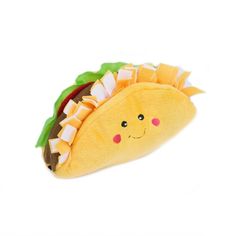 a taco stuffed animal on a white background