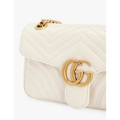 Find GUCCI Marmont Quilted Leather Shoulder Bag on Editorialist. This Gucci shoulder bag is crafted from quilted leather and features a clasp fastening, adjustable strap, front flap, brand plaque at the front, one main compartment, interior zipped pocket, and a lined interior. It measures 13cm in height, 21.5cm in width, and 6.5cm in depth. The bag can be worn on the shoulder or crossbody and comes with a dust bag. White Leather Shoulder Bag With Cc Turnlock Closure, Gucci Leather Bag With Turn-lock Closure, Gucci Top Handle Shoulder Bag With Turn-lock, Gucci Crossbody Bag With Turn-lock Closure, Gucci Luxury Shoulder Bag With Adjustable Strap, Gucci Soft Leather Crossbody Shoulder Bag, Gucci Soft Leather Rectangular Shoulder Bag, Everyday Luxury Leather Shoulder Bag With Turn-lock Closure, White Leather Gucci Shoulder Bag