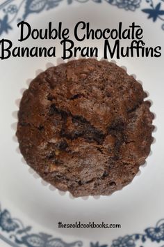 double chocolate banana bran muffins on a blue and white plate with text overlay