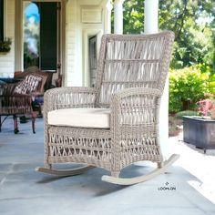 a wicker rocking chair on the front porch