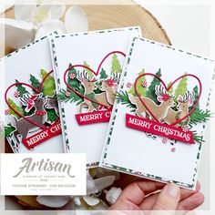 three handmade christmas cards with reindeer and heart shapes