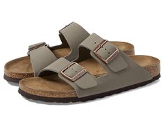 Birkenstock Arizona - Birkibuc (Unisex) - Sandals : Stone Birkibuc : Classic Birkenstock&amp,#174, sandal featuring adjustable straps to ensure a great fit. Birkibuc&amp,#8482, upper offers a textured finish that looks and feels like velvety nubuck. Birkenstock's contoured footbed offers firm stable support, a neutral stance with room for toes to stretch and spread, and a natural walking motion that encourages optimal toe movement and blood flow. This is the foundation of active recovery. Anatomically correct cork footbed, crafted from cork that is 100% renewable and sustainable, encourages foot health. Raised toe bar design allows for the natural gripping motion of your foot, exercising your legs and aiding circulation. Neutral heel profile and deep heel cup keeps the natural padding of y Unisex Sandals, Active Recovery, Neutral Heels, Foot Health, Birkenstock Arizona, Us Man, Blood Flow, Bar Design, Product Reviews