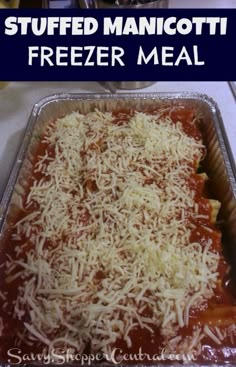 a pan filled with meat covered in sauce and grated parmesan cheese on top