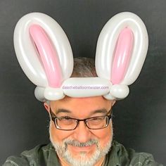 a man with glasses and bunny ears on his head