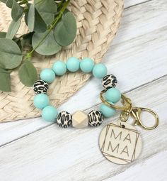 a bracelet that has a charm on it with a name tag attached to the bead