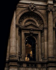 an old building with candles in the window