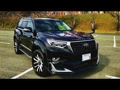 a black suv parked in a parking lot