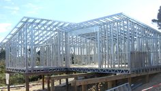 a metal frame structure sitting on top of a wooden platform