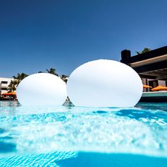 two large white balls floating in the water