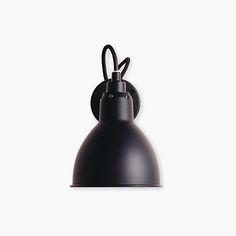 a black wall light on a white background