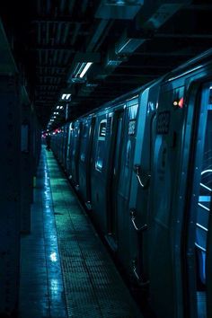 the subway train is stopped at the station for passengers to get on or off it