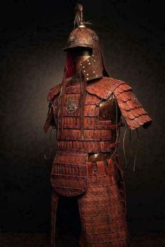 an old leather armor is displayed in the dark