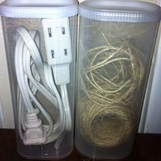 two plastic containers with wires and plugs in them