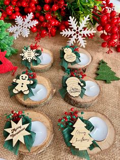 christmas decorations on wooden slices sitting on a table