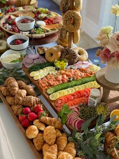 an assortment of fresh fruits and pastries on a buffet table