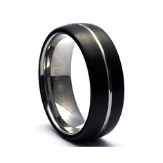 a black and silver wedding ring with an inlay