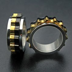 A fidget spinner for bikers? The gear surrounding this stainless steel ring moves. How dope is that? A beautiful, minimal design for discerning gearheads. Delivery: 2-4 weeks This product ships to you directly from our overseas supplier Use this guide to measure your ring size Lego Jewelry, Golden Age Of Piracy, Gear Ring, Ring Man, Biker Gifts, Spinning Rings, Road Rage, Mens Gear, Cross Ring