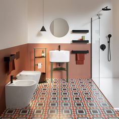 a bathroom with a sink, toilet and bathtub on the floor next to each other