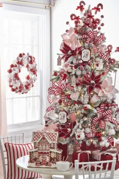 a christmas tree decorated with red and white ornaments