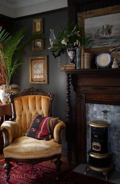 a living room filled with furniture and a fire place next to a potted plant