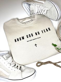 a pair of sneakers and a t - shirt with the words know god no fear on it