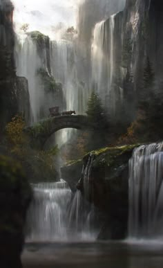 a waterfall with a bridge over it