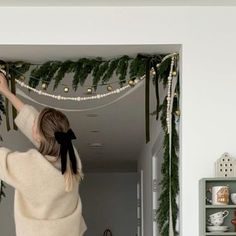 Snow Christmas Decor Ideas, Apartment Decorating On A Budget For Christmas, Christmas Decor Ribbon Ideas, Bows On Sconces For Christmas, Bows On Frames Christmas, Ribbons Hanging From Ceiling, Christmas Decor Ideas For Boutique, Dorm Xmas Decor, Commercial Christmas Decor Ideas