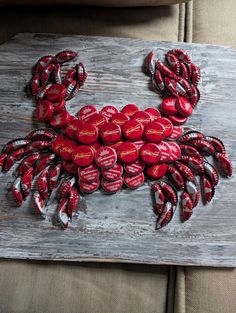 a crab made out of red and white buttons