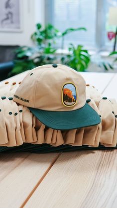 5-Panel 100% Cotton Cap. Featuring an embroidered patch on the front, lettering on the side, and an adjustable metal buckle. Designed for a landmark more than deserving of celebration. Perfect for the trails, the streets, or the sandy dunes of Bluffers Park. Flat Bill Baseball Cap With Logo Patch For Outdoor, Flat Brim Snapback Hat With Letter Patch For Outdoor, Logo Patch Baseball Cap For Outdoor Activities, Outdoor Fitted Snapback Hat With Logo Patch, Snapback Cap With Embroidered Logo For Outdoor, Logo Patch Snapback Hat For Outdoor Activities, Outdoor Snapback Hat With Letter Patch And Flat Brim, Snapback Cap With Embroidered Logo For Outdoor Activities, Fitted Snapback Hat With Logo Patch For Outdoor