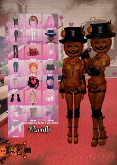 two dolls standing next to each other in front of a wall with pictures on it