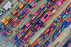 an aerial view of colorful shipping containers at a port