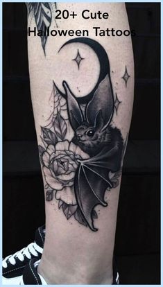 a black and white photo of a bat with roses on it's leg, next to the words 20 cute halloween tattoos