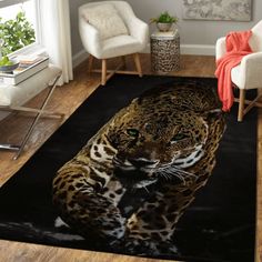 a living room area rug with a large leopard on it's floor and two chairs in the background